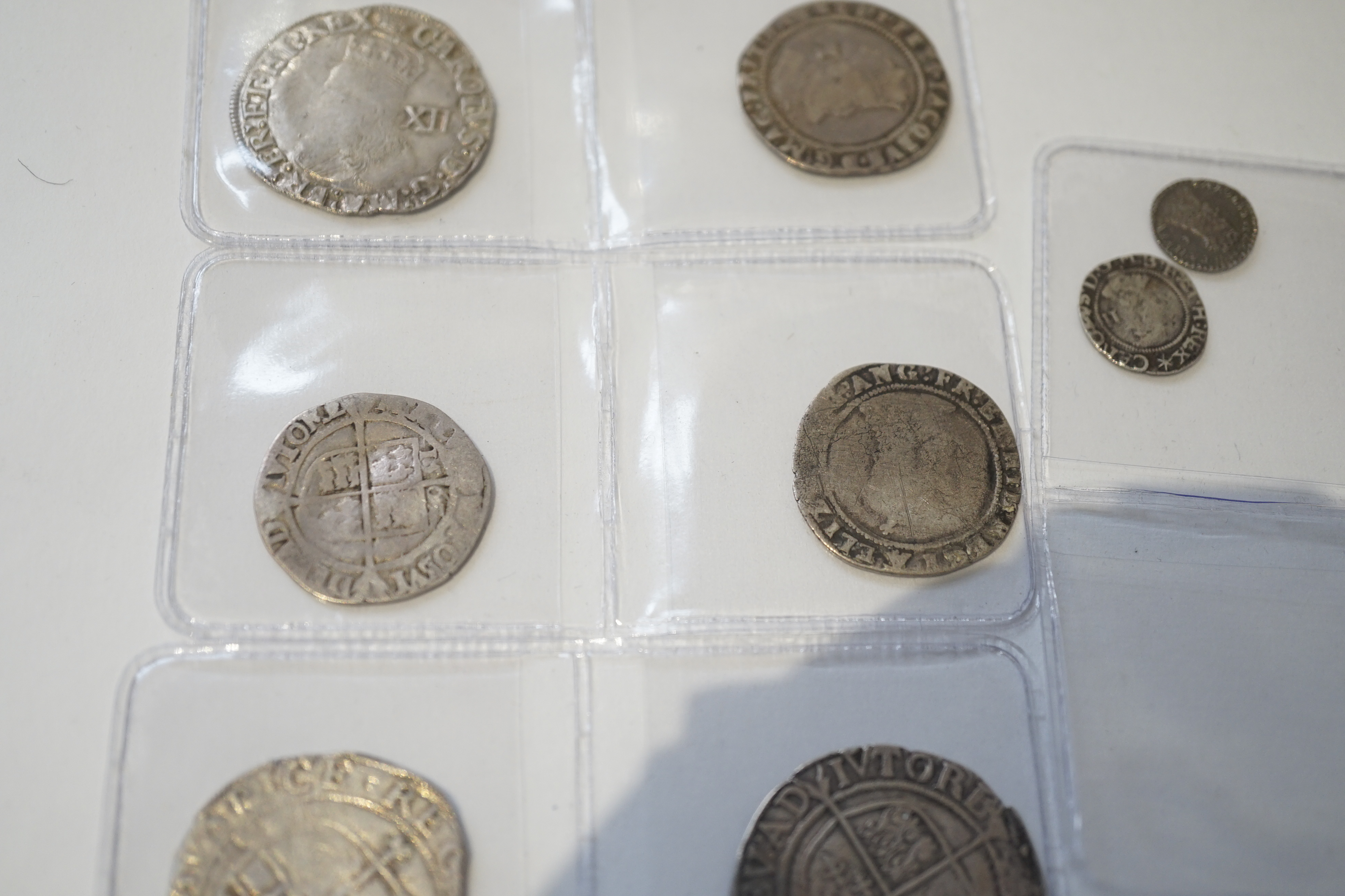 British Tudor and Stuart hammered silver coins, an Elizabeth I shilling and two sixpences, a James I sixpence, two Charles I shillings, a Charles II penny, first issue, 1660-62, (S3311) VF, twopence (S3310) (8)